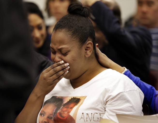 In this Dec. 20, 2013, file photo, Nailah Winkfield, mother of 13-year-old Jahi McMath, cries before a courtroom hearing regarding McMath, in Oakland, Calif.