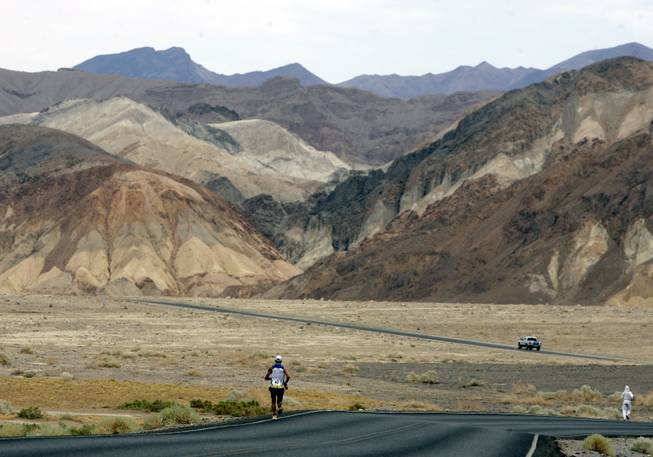 In this July 23, 2007, file photo, Valmir Nunes, of Brazil, runs in Kiehl's Badwater Ultramarathon in Death Valley, Calif.