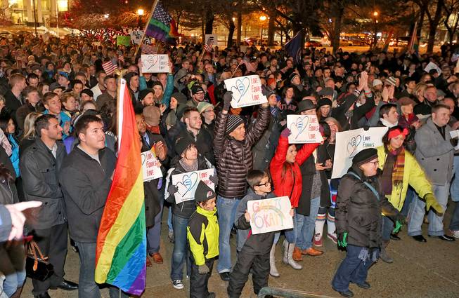 About 1,500 people gather to celebrate marriage equality after a federal judge declined to stay his ruling that legalized same-sex marriage in Utah, at Washington Square just outside of the Salt Lake City and County Building Monday, Dec. 23, 2013, in Salt Lake City.