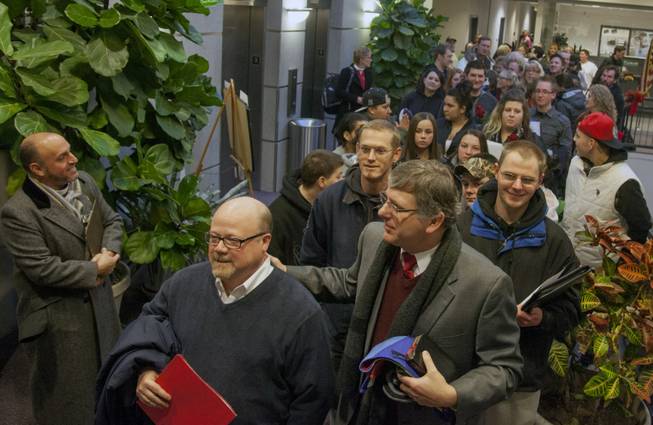Hundreds of people line up outside of the county clerk's office in the Weber Center on Dec. 23, 2013, the first day that Weber County began accepting applications for same-sex marriage licenses. Couples began lining up outside the building at 10pm on Sunday night due to concern that the state might only issue licenses for one hour before a possible stay could be placed on the ruling that allowed same-sex marriage.