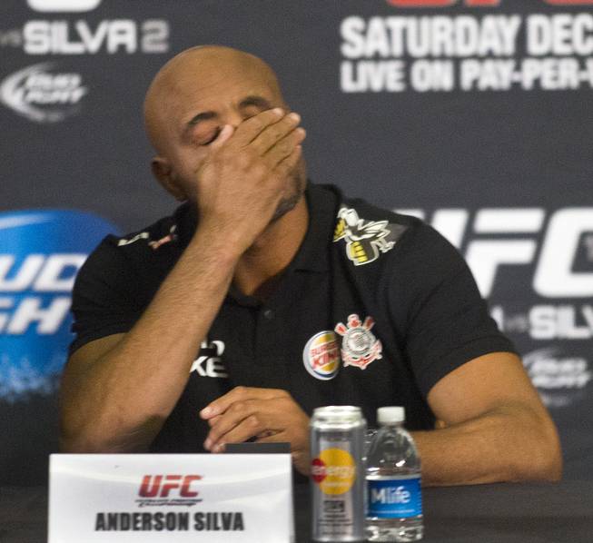Anderson Silva reacts to his opponent's response during a press conference for the upcoming UFC168 at the MGM Grand Hotel & Casino with commentary from the top fighters on the card Thursday, Dec. 26, 2013.