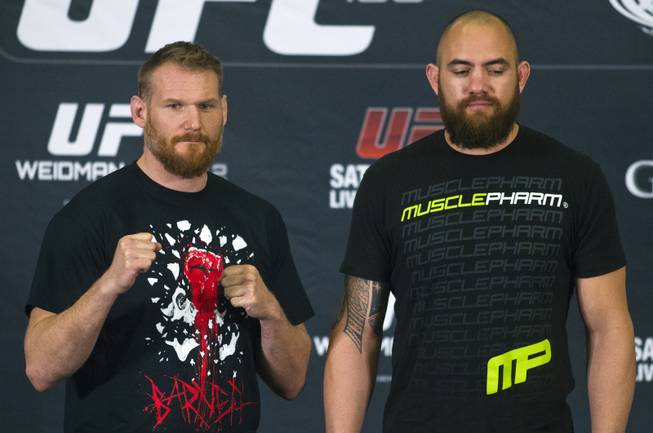 Josh Barnett and Travis Browne pose at the end of a press conference for the upcoming UFC168 at the MGM Grand Hotel & Casino with commentary from the top fighters on the card Thursday, Dec. 26, 2013.