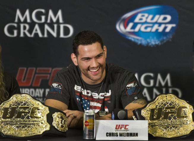 Chris Weidman reacts to a reporter's question during a press conference for the upcoming UFC168 at the MGM Grand Hotel & Casino with commentary from the top fighters on the card Thursday, Dec. 26, 2013.