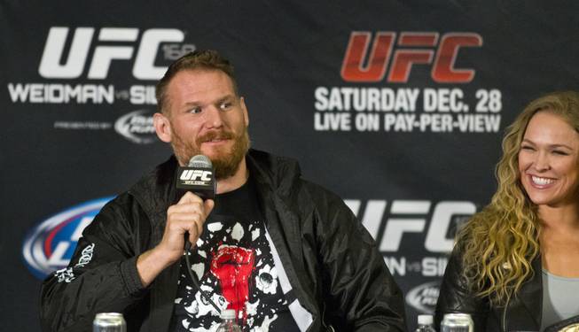 Josh Barnett jokes about reporter's sweater to Ronda Rousey's amusement during a press conference for the upcoming UFC168 at the MGM Grand Hotel & Casino with commentary from the top fighters on the card Thursday, Dec. 26, 2013.