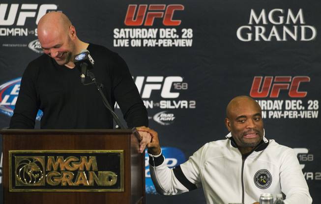 UFC president Dana White laughs as Anderson Silva makes a joke about their relationship during a press conference for the upcoming UFC168 at the MGM Grand Hotel & Casino with commentary from the top fighters on the card Thursday, Dec. 26, 2013.