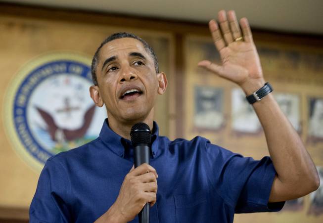 President Barack Obama speaks to members of the military and their families in Anderson Hall at Marine Corps Base Hawaii, Wednesday, Dec. 25, 2013, in Kaneohe Bay, Hawaii. The first family is in Hawaii for their annual holiday vacation.