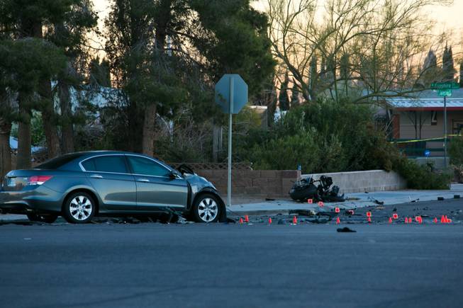 The scene of a fatal crash on Craig Road near Rainbow Boulevard is shown Thursday, Dec. 26, 2013.