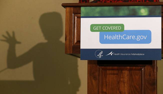 The shadow of Health and Human Services Secretary Kathleen Sebelius is cast on a wall as she speaks at the Community Health and Social Services Center in Detroit, Nov. 15, 2013.