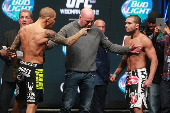 Dustin Poirier yells at Diego Brandao after Brandao came in seven pounds overweight during the weigh in for UFC 168 Friday, Dec. 27, 2013 at the MGM Grand Garden Arena.