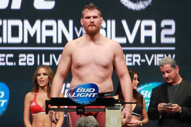 Heavyweight Josh Barnett stands on the scale during the weigh in for UFC 168 Friday, Dec. 27, 2013 at the MGM Grand Garden Arena.