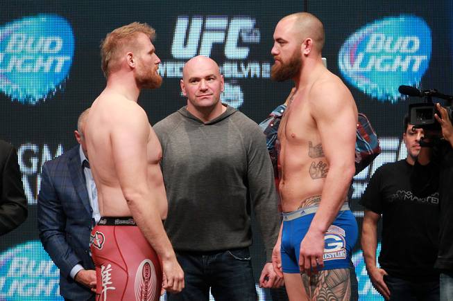 Josh Barnett and Travis Browne face off during the weigh in for UFC 168 Friday, Dec. 27, 2013 at the MGM Grand Garden Arena.