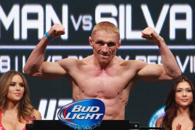 Dennis Siver flexes after making weight for his fight against Manvel Gamburyan during the weigh in for UFC 168 Friday, Dec. 27, 2013 at the MGM Grand Garden Arena.