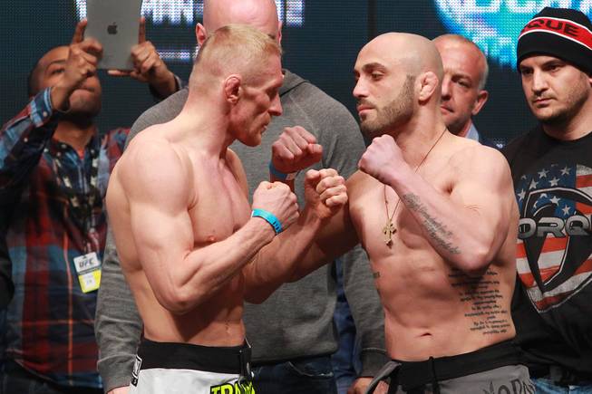 Dennis Siver and Manvel Gamburyan face off during the weigh in for UFC 168 Friday, Dec. 27, 2013 at the MGM Grand Garden Arena.