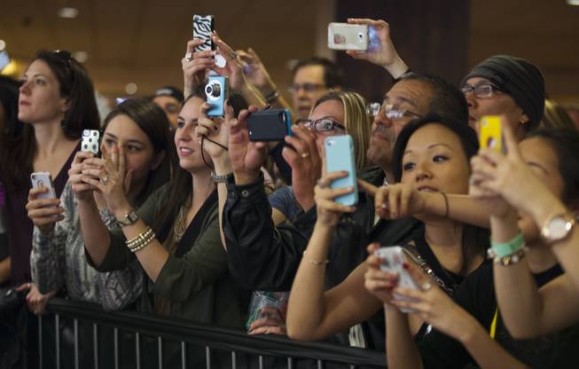 Fans capture images of stars at the red carpet for the grand opening of Britney Spears’ “Britney: Piece of Me” at Planet Hollywood on Friday, Dec. 27, 2013, in Las Vegas.