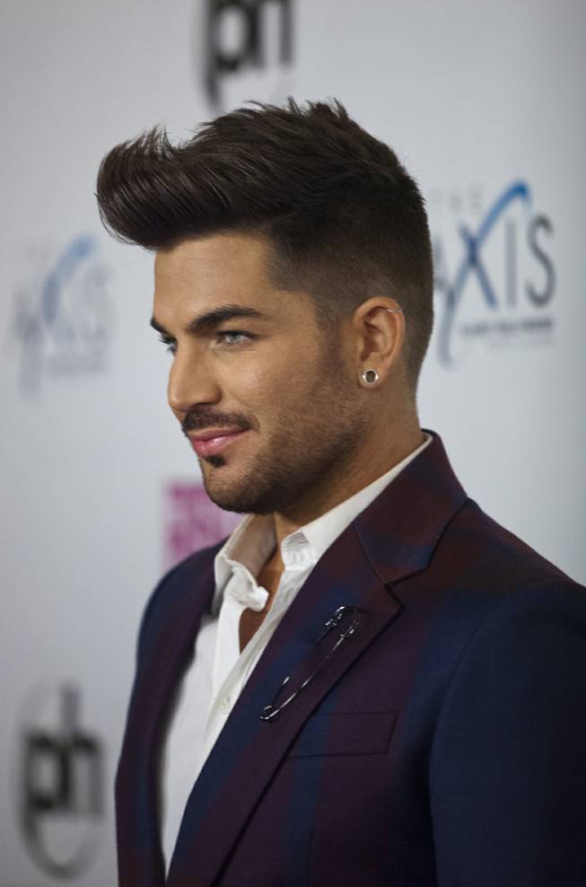Adam Lambert arrives at the red carpet for the grand opening of Britney Spears’ “Britney: Piece of Me” at Planet Hollywood on Friday, Dec. 27, 2013, in Las Vegas.