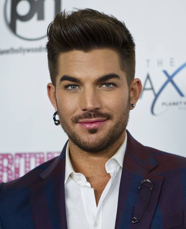Adam Lambert arrives at the red carpet for the grand opening of Britney Spears’ “Britney: Piece of Me” at Planet Hollywood on Friday, Dec. 27, 2013, in Las Vegas.