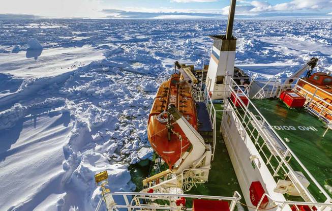 In this image provided by Australasian Antarctic Expedition/Footloose Fotography, Russian ship MV Akademik Shokalskiy is trapped in thick Antarctic ice, 1,500 nautical miles south of Hobart, Australia, Friday, Dec. 27, 2013.