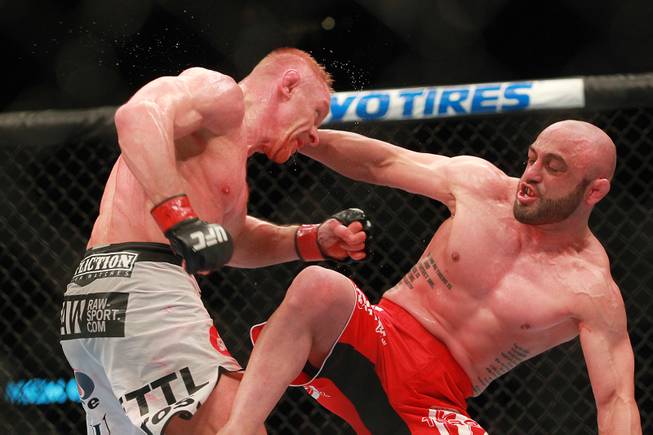 Dennis Siver gets hit by  Manvel Gamburyan during their fight at UFC 168 Saturday, Dec. 28, 2013 at the MGM Grand Garden Arena.