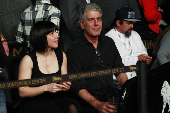 Television personality, author and chef Anthony Bourdain sits Octagon-side for the title fight between Ronda Rousey and Miesha at UFC 168 Saturday, Dec. 28, 2013 at the MGM Grand Garden Arena.