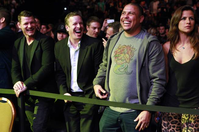 UFC middleweight Michael Bisping, left, and former Brazilian soccer superstar Ronaldo laugh before the middleweight title fight between champion Chris Weidman and Anderson Silva at UFC 168 Saturday, Dec. 28, 2013 at the MGM Grand Garden Arena.
