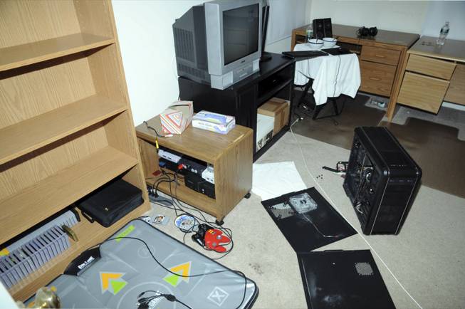 This Dec. 16, 2012, photo released by the Connecticut State Police shows what the evidence report describes as an overall view of the computer room in the house where Adam Lanza lived with his mother in Newtown, Conn. The photo was released as part of the evidence gathered by police during their investigation after Adam Lanza gunned down 20 first-graders and six educators with a semi-automatic rifle at Sandy Hook Elementary School.