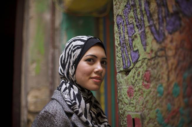 In this Tuesday, Dec. 10, 2013, photo, Egyptian rapper Myam Mahmoud poses for a portrait in downtown Cairo. Mahmoud, an 18-year-old Egyptian, rapped her way to the semi-finals of the Middle East’s hit TV show “Arabs Got Talent.” 