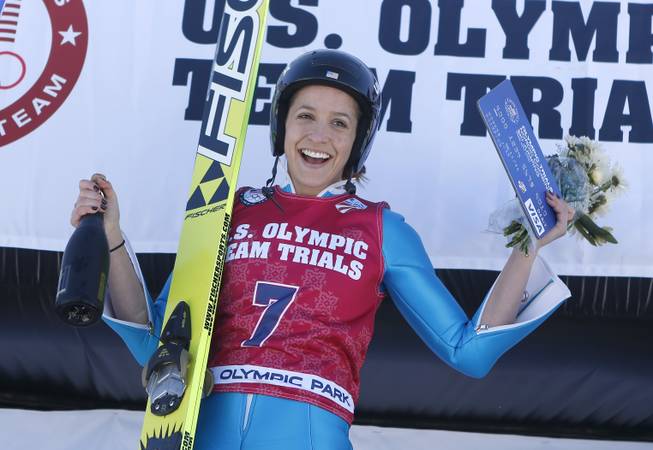First-place finisher Jessica Jerome reacts on the podium after women's ski jumping event  at the U.S. Olympic trials in Park City, Utah, Sunday, Dec. 29, 2013. 
