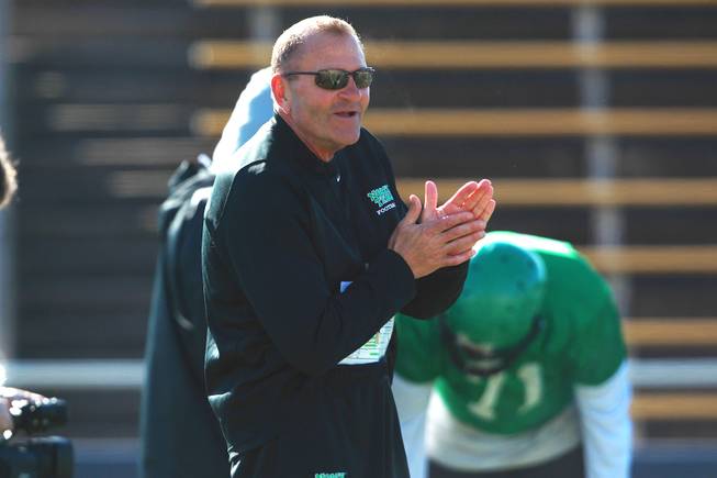 Head coach Dan McCarney talks to his players during the North Texas practice for the Heart of Dallas Bowl Monday, Dec. 30, 2013 at Highland Park High School in Dallas.