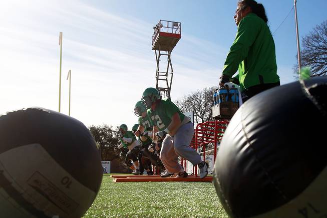 Linemen run through drills during the North Texas practice for the Heart of Dallas Bowl Monday, Dec. 30, 2013 at Highland Park High School in Dallas.