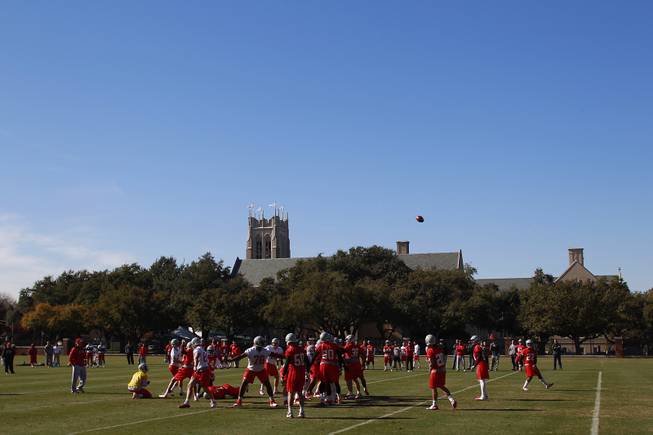 The UNLV football team practices on the campus of Southern Methodist University for the Heart of Dallas Bowl Monday, Dec. 30, 2013 in Dallas.