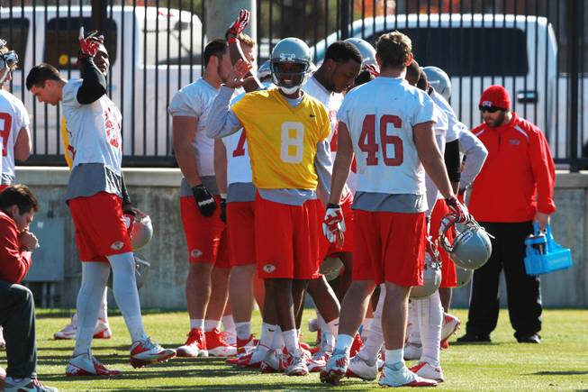 UNLV quarterback Caleb Herring, center, jokes around with teammates during a break in UNLV's practice on the campus of Southern Methodist University for the Heart of Dallas Bowl Monday, Dec. 30, 2013 in Dallas.