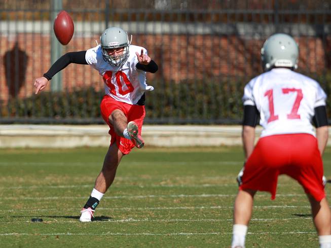 Kicker Nicolai Bornand launches a ball during UNLV's practice on the campus of Southern Methodist University for the Heart of Dallas Bowl Monday, Dec. 30, 2013 in Dallas.