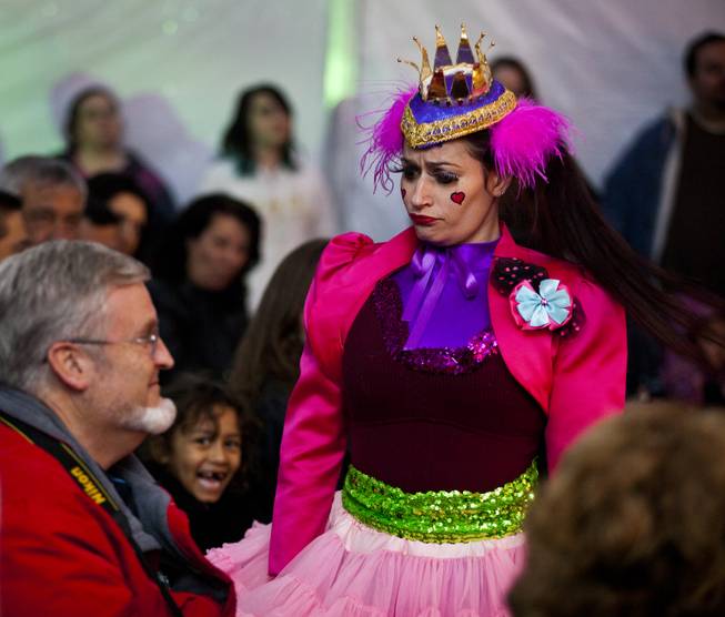 Actress Emily Lauren, as an unhappy fairy tale queen, searches the audience for an old man during a family variety show in the Magical Forest at Opportunity Village on Monday , Dec. 30, 2013. L.E. Baskow