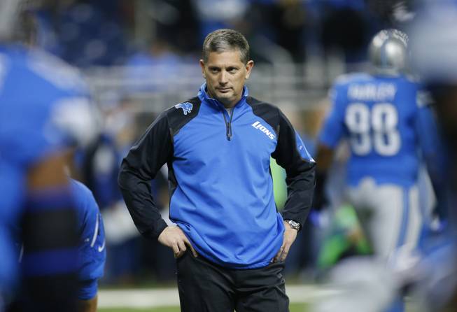 In this Dec. 16, 2013, photo, Detroit Lions head coach Jim Schwartz watches warmups before the first quarter of an NFL football game against the Baltimore Ravens in Detroit.