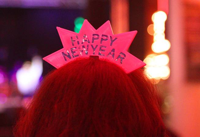 A tiara is shown on the head of a partier during New Year's Eve festivities at the Fremont Street Experience in downtown Las Vegas Tuesday, Dec. 31, 2013. An estimated 335,000 tourists were expected to visit Las Vegas to celebrate the new year.