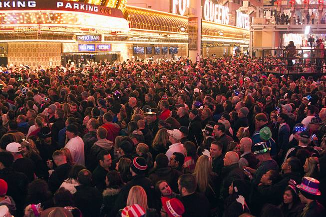 A look at the crowd during New Years Eve festivities at the Fremont Street Experience in downtown Las Vegas Tuesday, Dec. 31, 2013. An estimated 335,000 tourists were expected to visit Las Vegas to celebrate the new year.