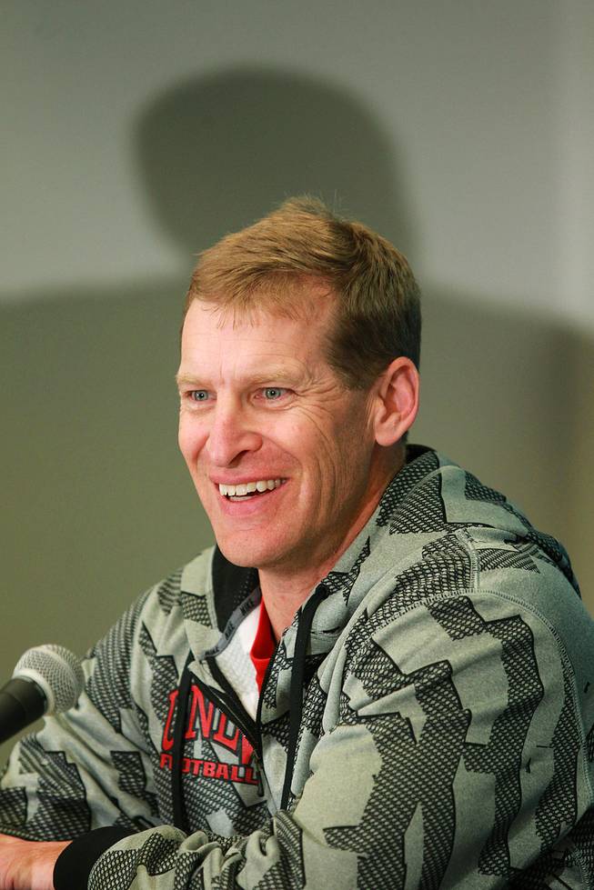 UNLV head coach Bobby Hauck laughs during a news conference for the Heart of Dallas Bowl Tuesday, Dec. 31, 2013 at the Cotton Bowl in Dallas.