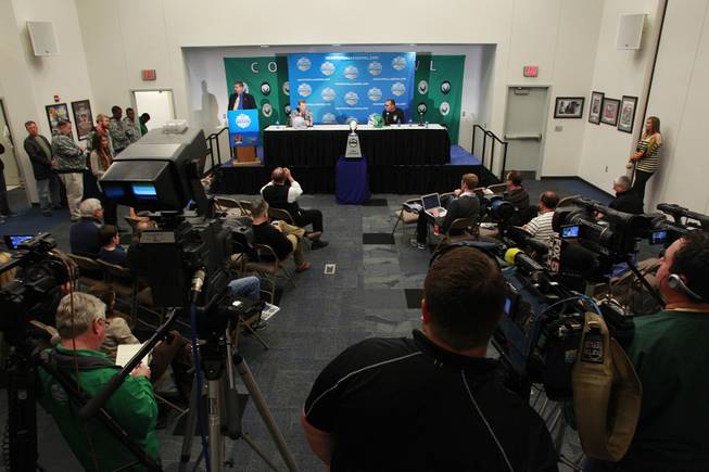 UNLV head coach Bobby Hauck and North Texas head coach Dan McCarney take questions during a news conference for the Heart of Dallas Bowl Tuesday, Dec. 31, 2013 at the Cotton Bowl in Dallas.