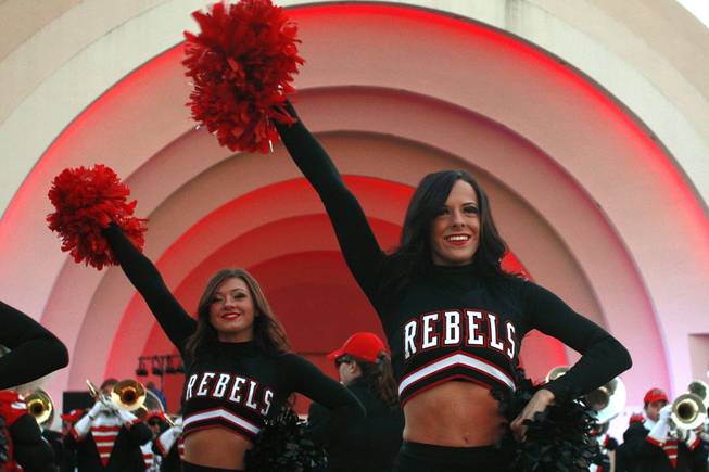 UNLV cheerleaders perform during a pep rally for the Heart of Dallas Bowl Tuesday, Dec. 31, 2013 at the state fairgrounds near the Cotton Bowl in Dallas.