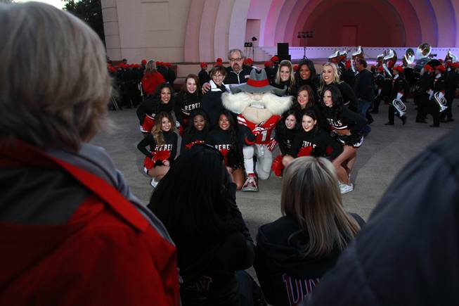 Fans have their photo taken with Hey Reb and UNLV cheerleaders during a pep rally for the Heart of Dallas Bowl Tuesday, Dec. 31, 2013 at the state fairgrounds near the Cotton Bowl in Dallas.