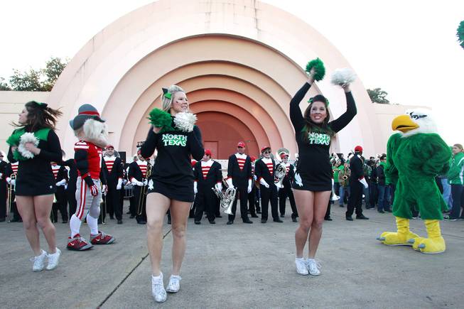Hey Reb and Scrappy, the North Texas mascot, face off during a pep rally for the Heart of Dallas Bowl Tuesday, Dec. 31, 2013 at the state fairgrounds near the Cotton Bowl in Dallas.