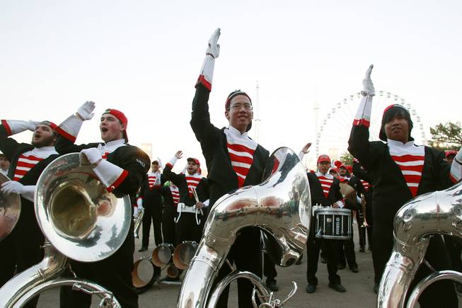 UNLV band members perform the UNLV "Rebels" chant during a pep rally for the Heart of Dallas Bowl Tuesday, Dec. 31, 2013 at the state fairgrounds near the Cotton Bowl in Dallas.