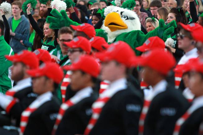 Scrappy, the North Texas mascot, performs during a pep rally for the Heart of Dallas Bowl Tuesday, Dec. 31, 2013 at the state fairgrounds near the Cotton Bowl in Dallas.