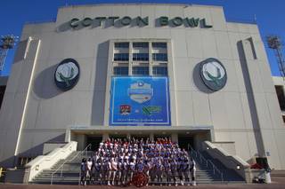 The UNLV football team has their team photo taken for the Heart of Dallas Bowl Tuesday, Dec. 31, 2013 at the Cotton Bowl in Dallas.