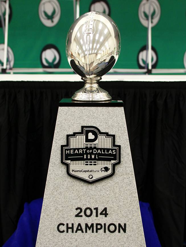 The Heart of Dallas Bowl trophy is seen in the media room Tuesday, Dec. 31, 2013 at the Cotton Bowl in Dallas.
