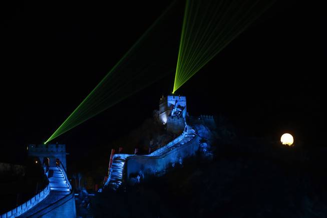 Laser lights shoot from towers during a New Year's Eve count down to 2014 held at the Great Wall of China in Beijing, China, Tuesday, Dec. 31, 2013.