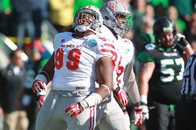 UNLV lineman Tyler Gaston celebrates a sack of North Texas during the first half of the Heart of Dallas Bowl Wednesday, Jan. 1, 2014 the Cotton Bowl in Dallas.