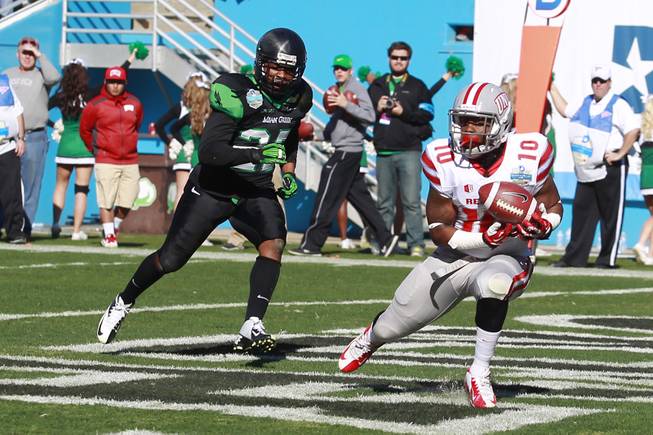 UNLV wide receiver Jerry Rice Jr. catches a touchdown pass under coverage by North Texas defensive back Peter Ashton during the Heart of Dallas Bowl Wednesday, Jan. 1, 2014 at the Cotton Bowl in Dallas. North Texas won 36-14.