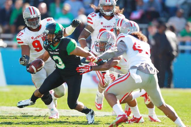 North Texas wide receiver Brelan Chancellor scoots away from the UNLV defense during the Heart of Dallas Bowl Wednesday, Jan. 1, 2014 at the Cotton Bowl in Dallas. North Texas won 36-14.