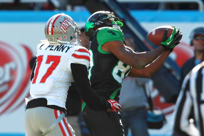 North Texas wide receiver Darnell Smith beats UNLV defensive back Kenneth Penny for a touchdown during the Heart of Dallas Bowl Wednesday, Jan. 1, 2014 at the Cotton Bowl in Dallas. North Texas won 36-14.